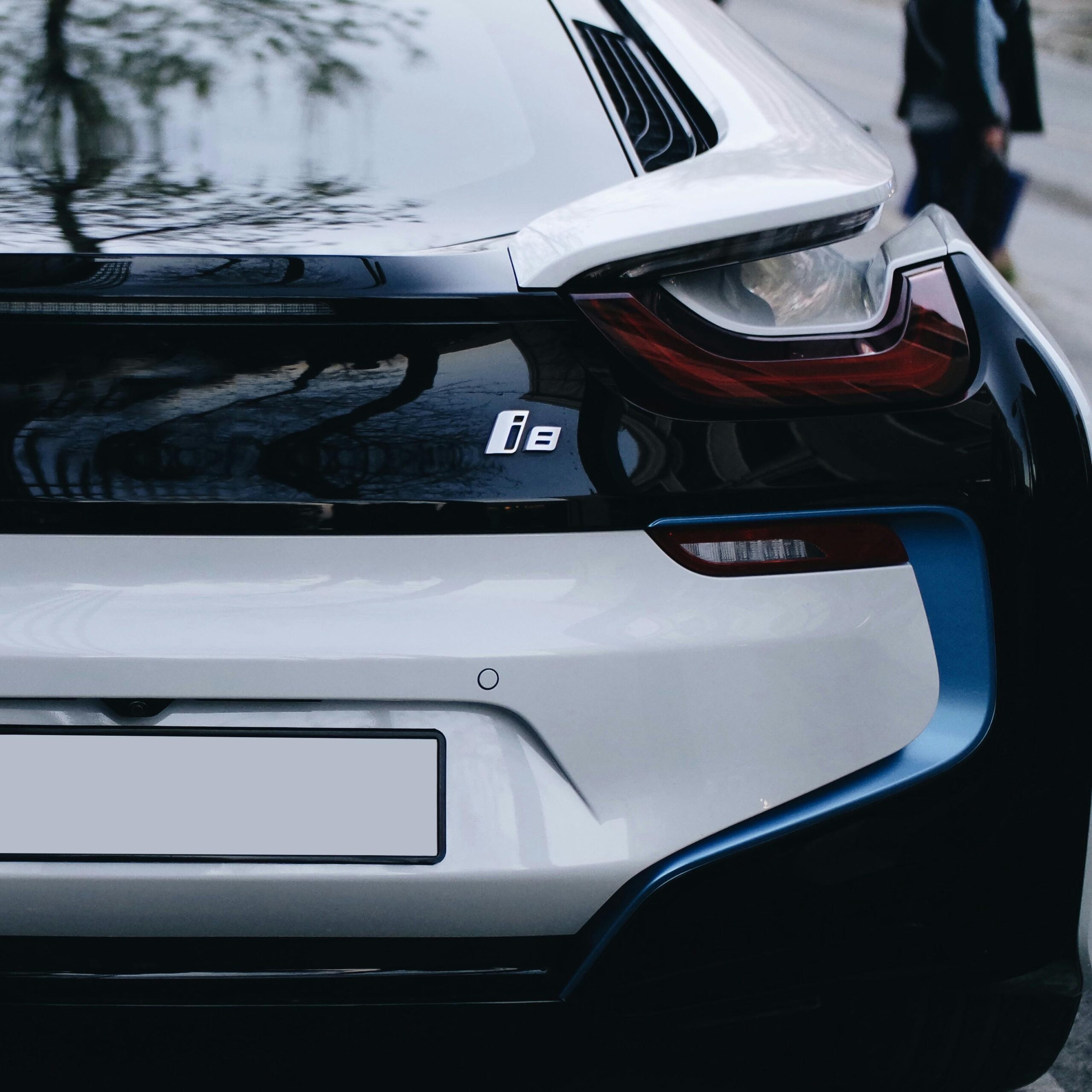 Elegant rear close-up of a BMW i8 showcasing its sophisticated design and electric features.
